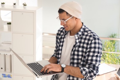 Freelancer working on laptop in home office