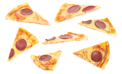 Image of Set with slices of pepperoni pizza on white background