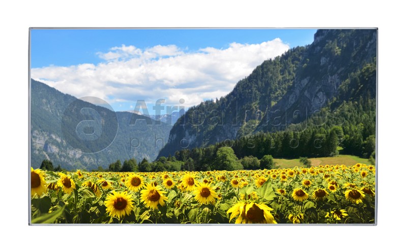 Image of Modern wide screen TV monitor showing mountain landscape, isolated on white