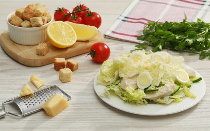 Photo of Delicious salad with Chinese cabbage, eggs and meat served on wooden table