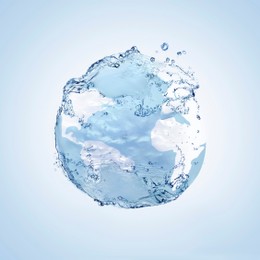 Sphere made of water splashes on light blue background