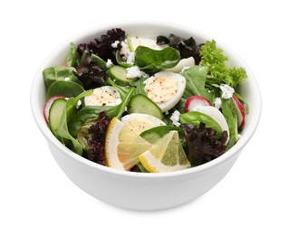 Delicious salad with boiled eggs, vegetables and lemon in bowl isolated on white