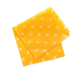 Yellow reusable beeswax food wrap on white background, top view
