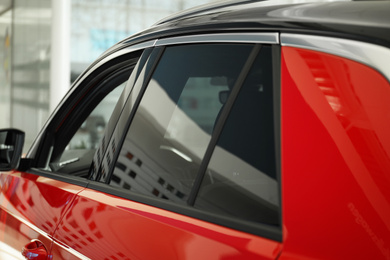 Modern car with tinting foil on window, closeup
