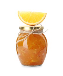 Delicious orange marmalade in glass jar with citrus fruit slice isolated on white