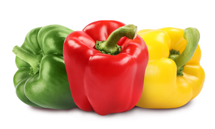 Fresh different bell peppers on white background