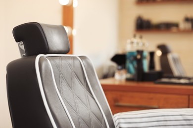 Closeup view of professional barber chair in hairdressing salon