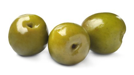 Three fresh green olives on white background