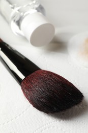 Photo of Makeup brush drying after cleaning on paper towel, closeup