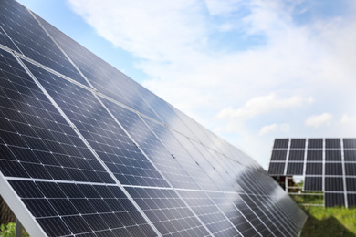 Photo of Solar panels installed outdoors, closeup. Alternative energy source