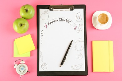 Photo of Nutrition Checklist. Flat lay composition with clipboard, alarm clock and apples on pink background