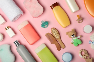Photo of Flat lay composition with baby cosmetic products on pink background
