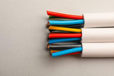 Electrical cables with wires on light background, closeup