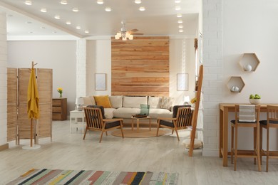 Photo of Stylish sofa in living room. Interior design