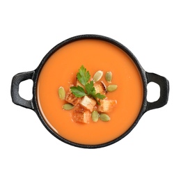 Tasty creamy pumpkin soup with croutons, seeds and parsley in bowl on white background, top view
