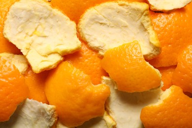 Photo of Many orange peels preparing for drying as background, closeup