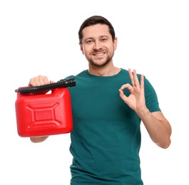 Photo of Man holding red canister and showing OK gesture on white background