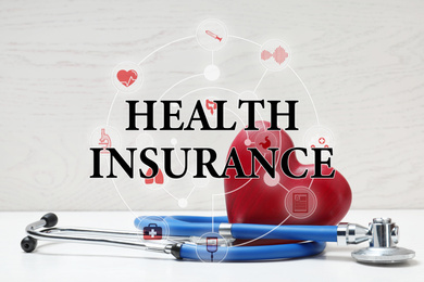 Phrase Health Insurance, stethoscope, red heart and icons on light background