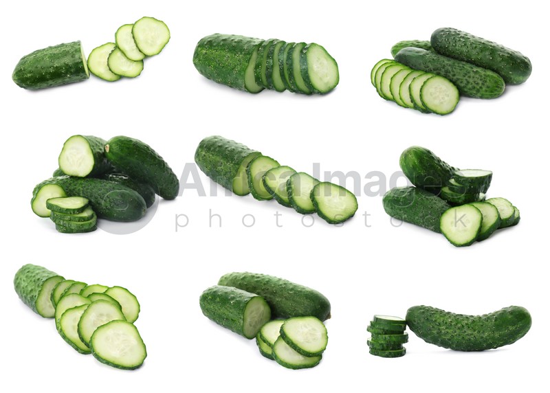 Set with whole and cut ripe cucumbers on white background