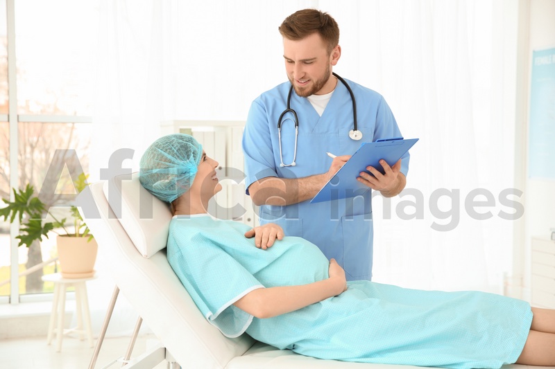 Gynecology consultation. Pregnant woman with her doctor in clinic