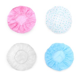 Set with waterproof shower caps on white background, top view