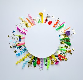 Frame of festive items on white background, flat lay with space for text. Surprise party concept
