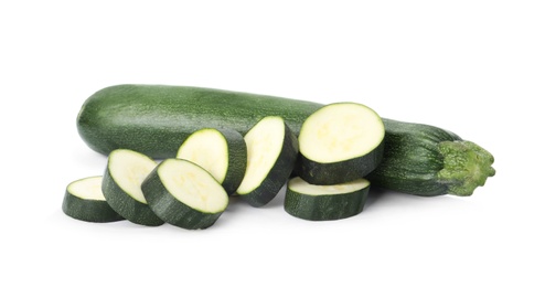 Cut and whole green ripe zucchini isolated on white