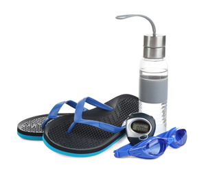 Swimming goggles, water bottle, flip flops and digital stopwatch isolated on white