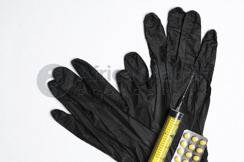 Flat lay composition with medical gloves on white background