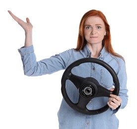 Emotional young woman with steering wheel on white background