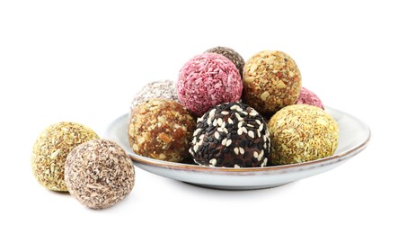 Different delicious vegan candy balls on white background