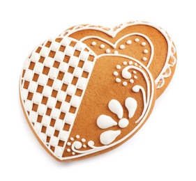 Photo of Gingerbread hearts decorated with icing on white background, above view
