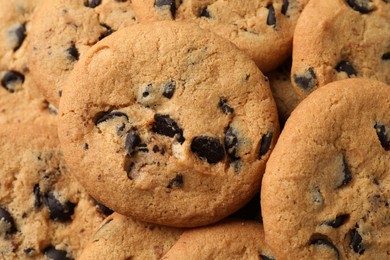 Delicious chocolate chip cookies as background, closeup