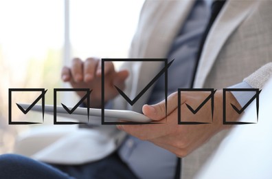 Image of Illustration of check boxes with marks and man using tablet indoors, closeup