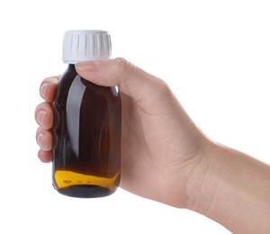 Woman holding bottle of syrup isolated on white, closeup. Cough and cold medicine