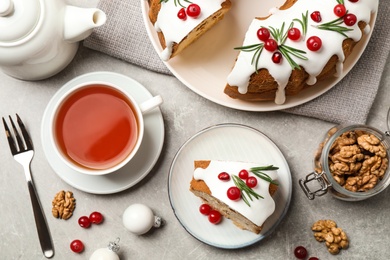 Photo of Flat lay composition with traditional homemade Christmas cake on light grey table