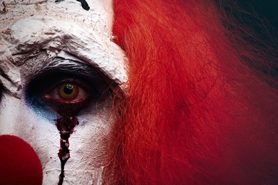 Terrifying clown, closeup view. Halloween party costume