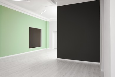 Photo of Empty office room with color walls. Interior design