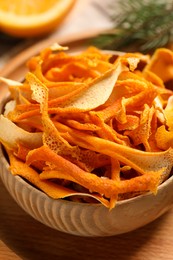 Photo of Dry orange peels on table, closeup view