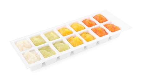 Different purees in ice cube tray on white background. Ready for freezing