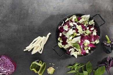 Delicious salad with Chinese cabbage, suluguni cheese and bell pepper on grey table, flat lay. Space for text