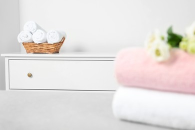 Different folded soft terry towels in room