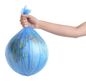 Photo of Woman holding globe in plastic bag on white background, closeup. Environmental protection concept