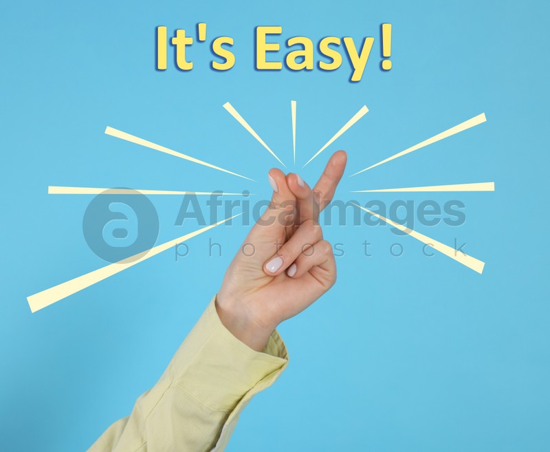 Phrase It's Easy and woman snapping fingers on light blue background, closeup
