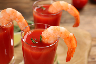 Photo of Delicious shrimp cocktail with tomato sauce, closeup