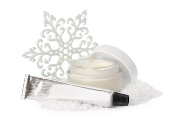 Photo of Set of cosmetic products with hand cream and Christmas decor isolated on white. Winter skin care
