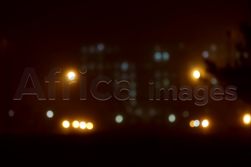 Photo of Blurred view of night city. Bokeh effect