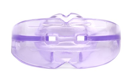 Photo of Transparent dental mouth guard isolated on white. Bite correction