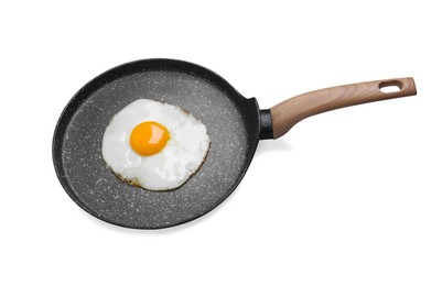 Frying pan with delicious fried egg isolated on white