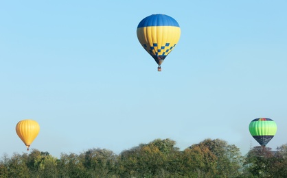 Beautiful view of hot air balloons flying over countryside